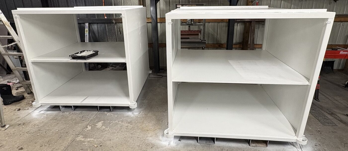 White industrial storage crates for ferry cargo