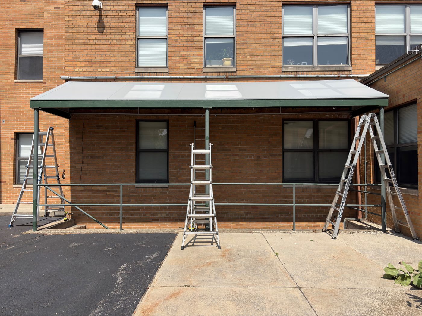 Installed commercial canvas awning on brick building